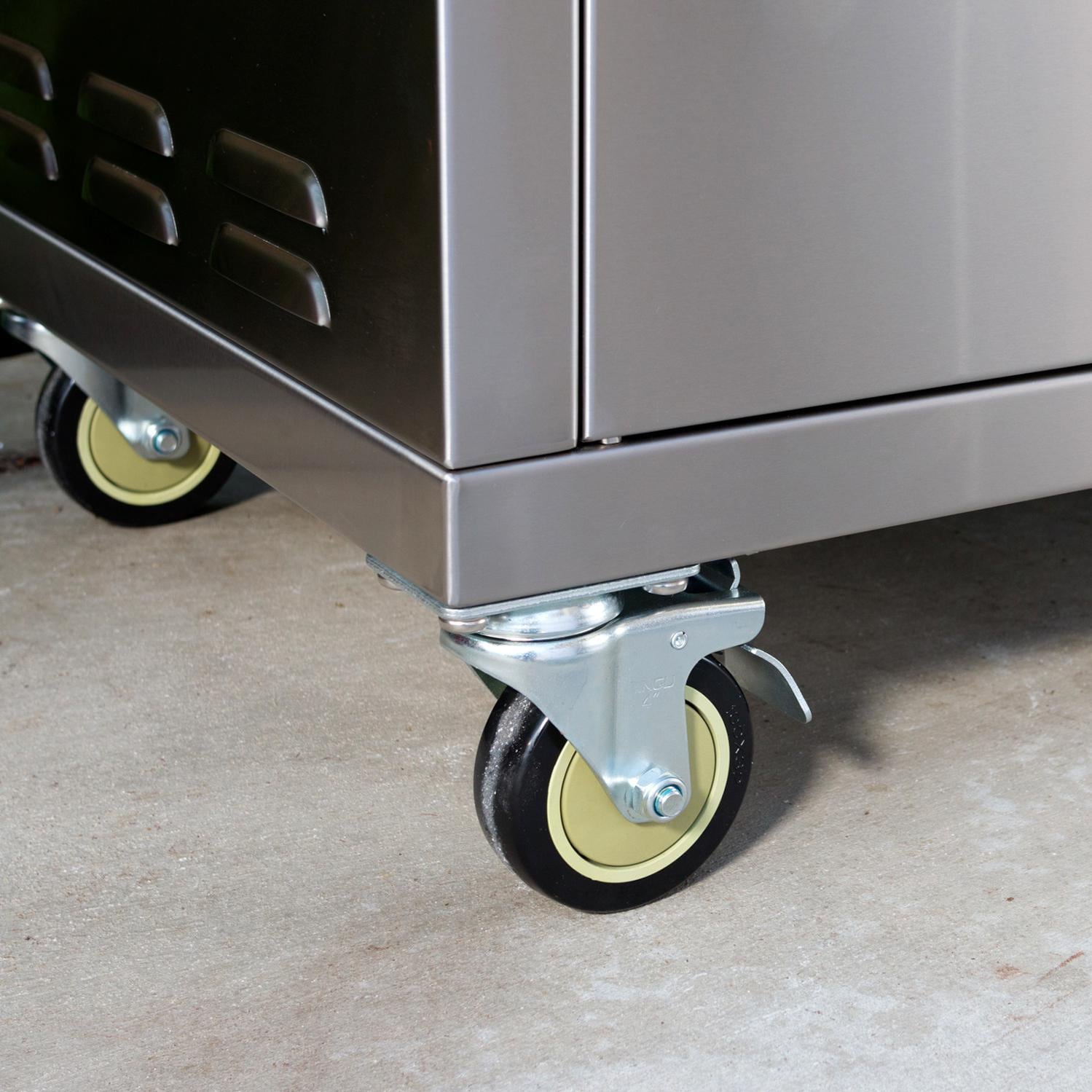 Close-up of a metal cart with wheels on a concrete floor