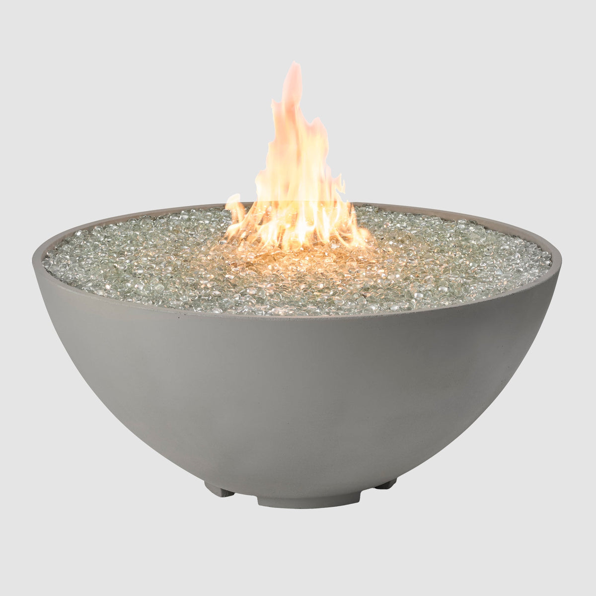 Cove Concrete Edge 42-inch round gas fire pit bowl in Natural Grey with lit flame on grey background
