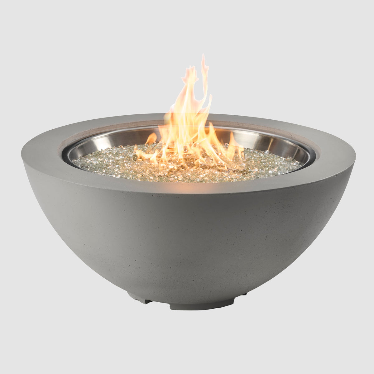 42-inch Cove Concrete round gas fire pit bowl in Natural Grey with lit flame on grey background