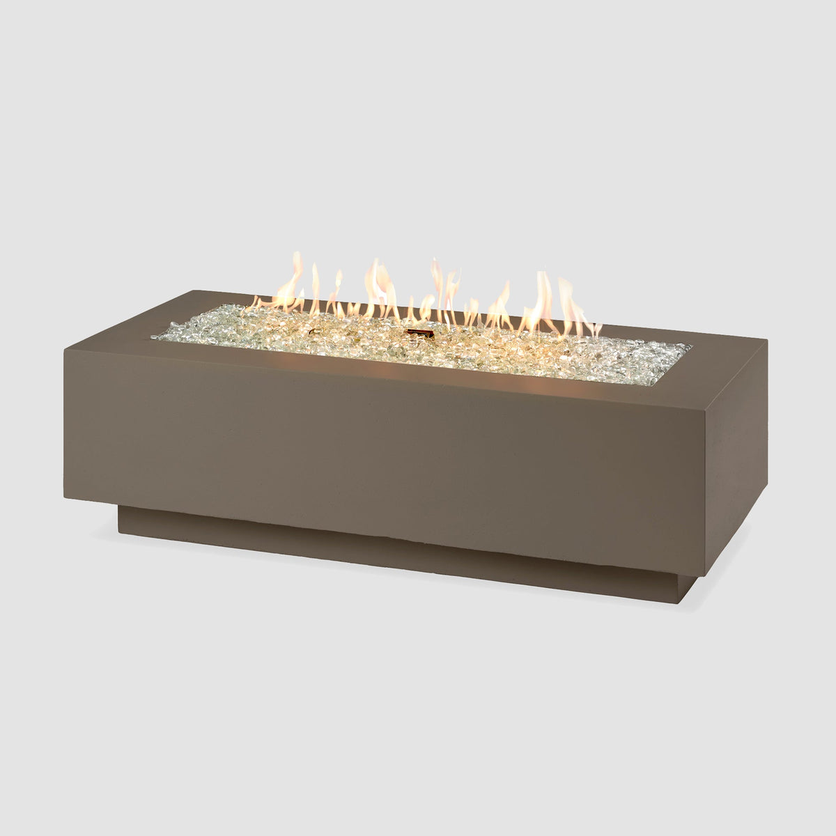 54-inch Cove Concrete linear gas fire pit in Earth Stone with lit flame