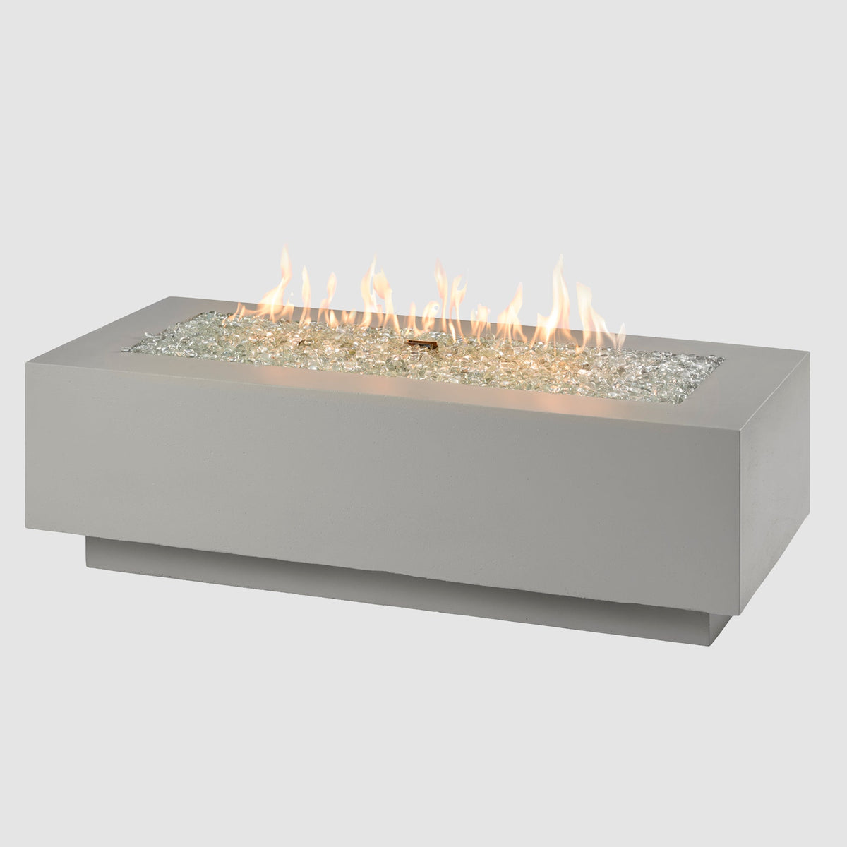 54-inch Cove Concrete linear gas fire pit in Natural Grey with lit flame on grey background