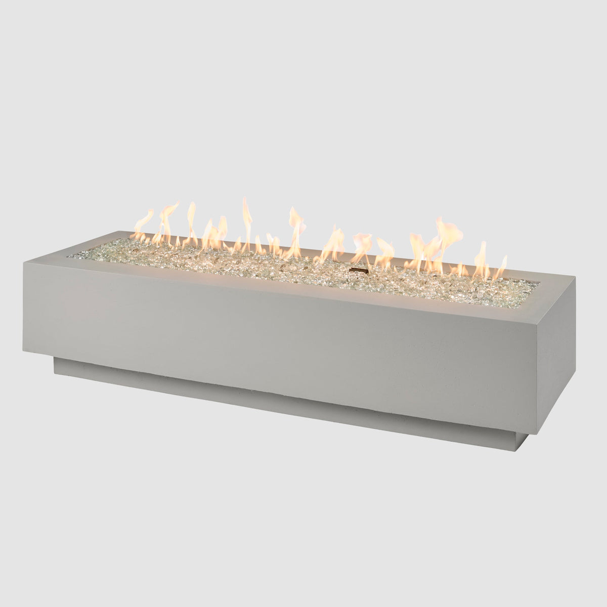 72-inch Cove Concrete linear gas fire pit in Natural Grey with lit flame on grey background