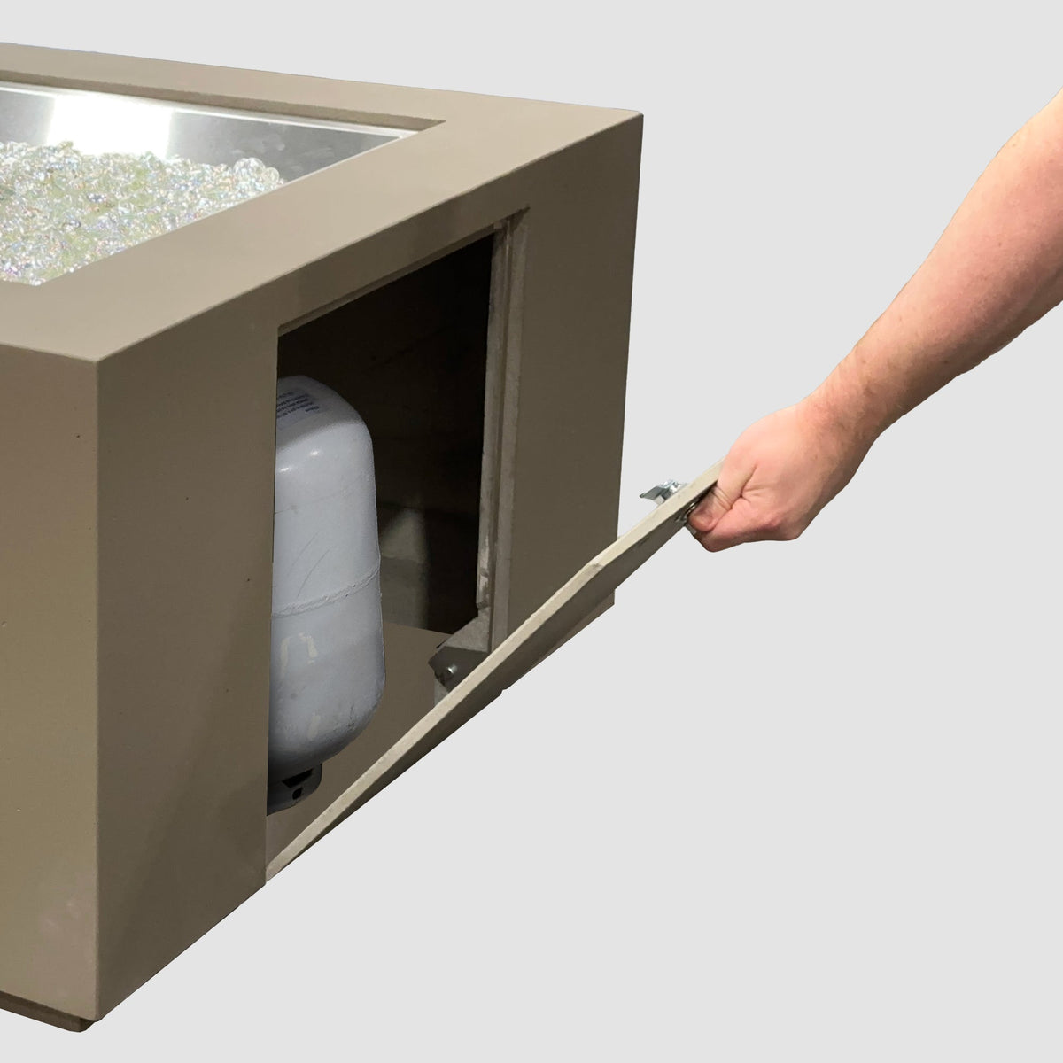 36-inch Cove Concrete square gas fire pit table in Earth Stone showing the propane tank access door