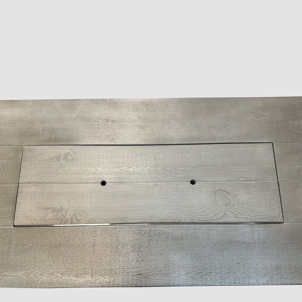 Top-down view of the Cedar Ridge fire pit table with the Supercast burner cover in place