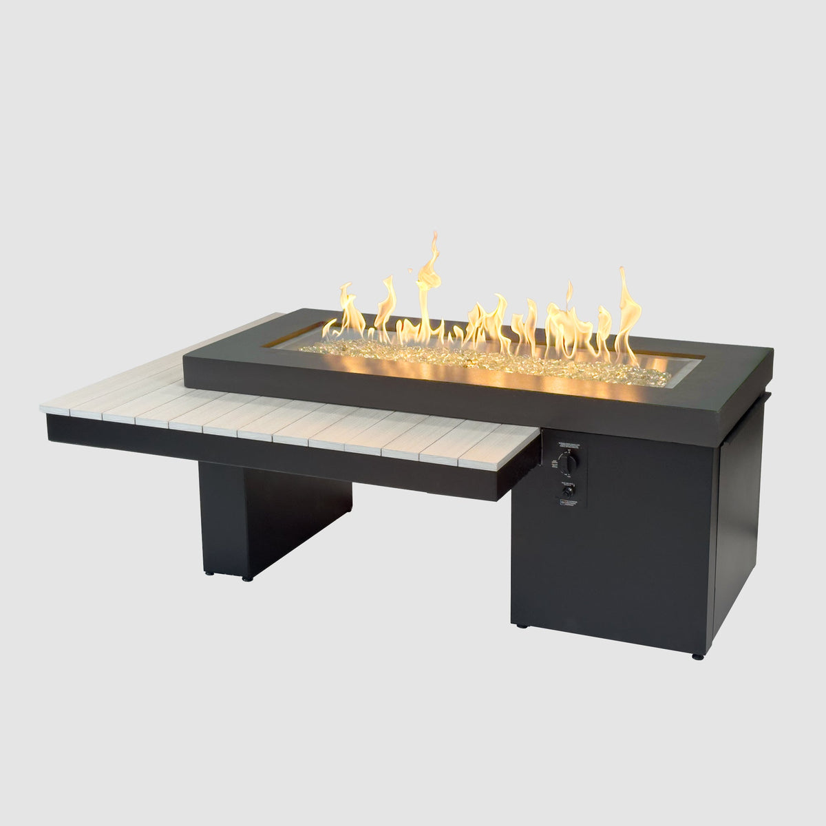 Uptown Seashell linear gas fire pit table lit on a grey background