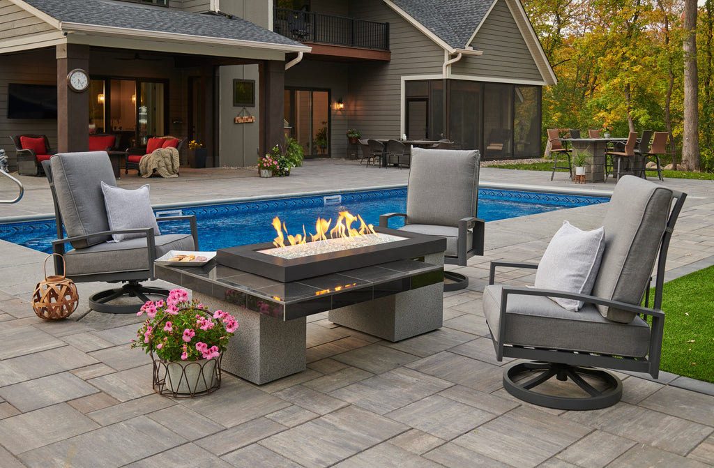 Uptown Black fire pit table with a lit flame