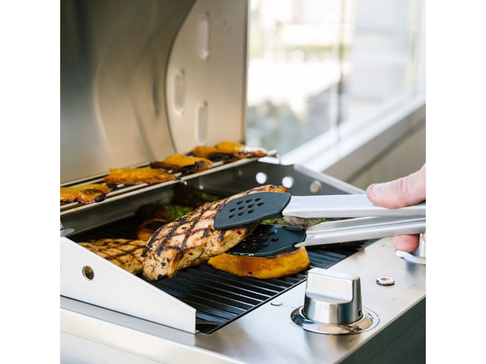 coyote 18-inch built-in / portable 1300 watt electric grill on patio post