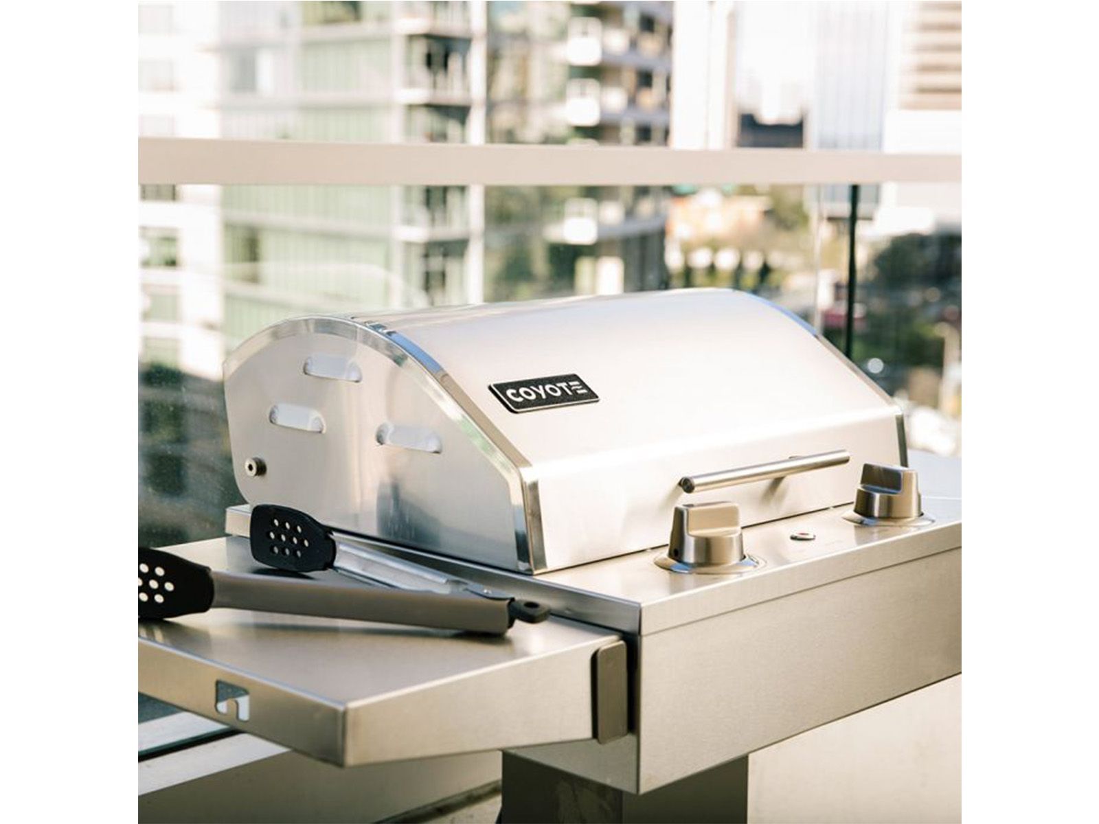 coyote 18-inch built-in / portable 1300 watt electric grill on patio post