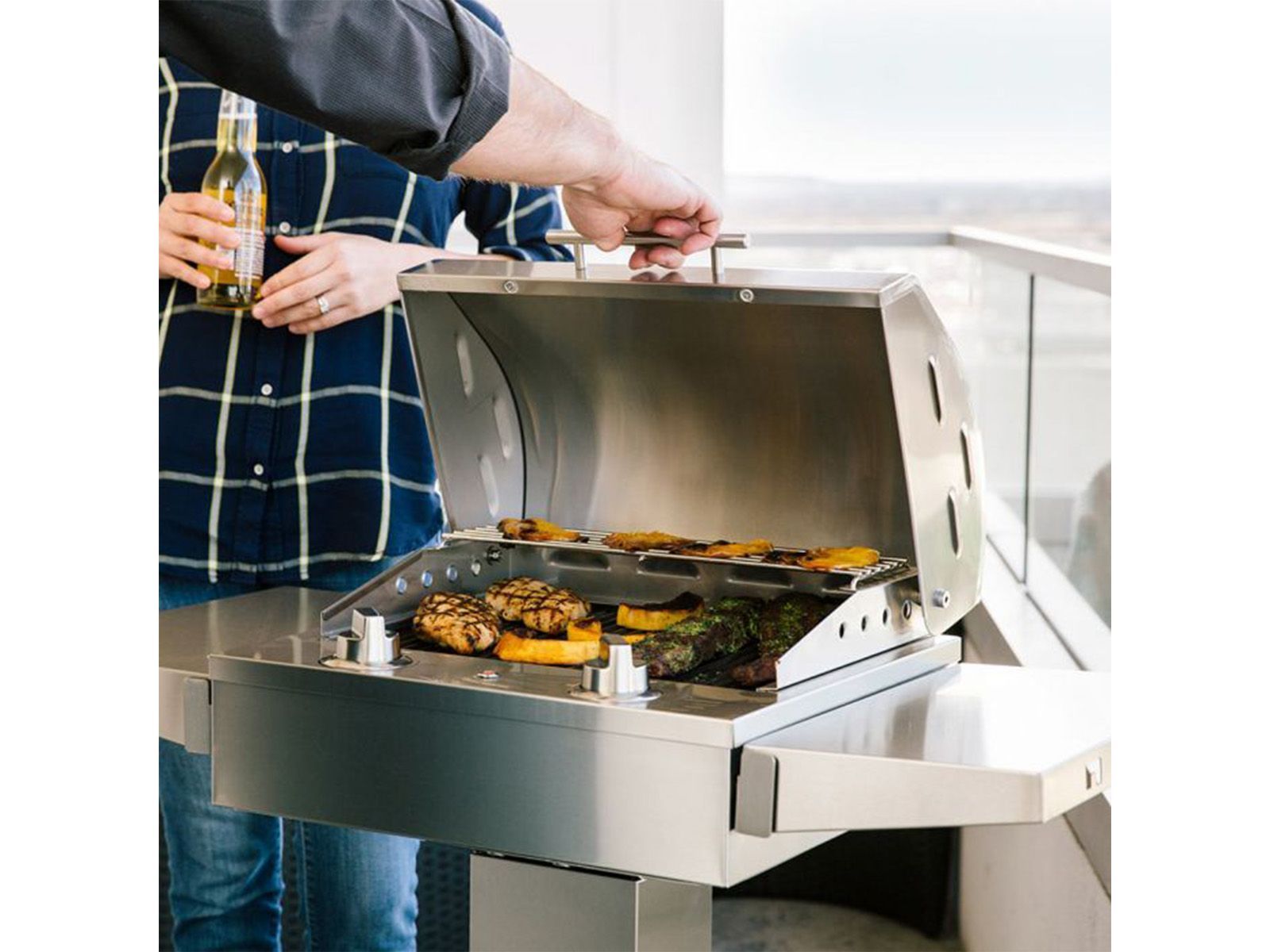 coyote 18-inch built-in / portable 1300 watt electric grill on patio post